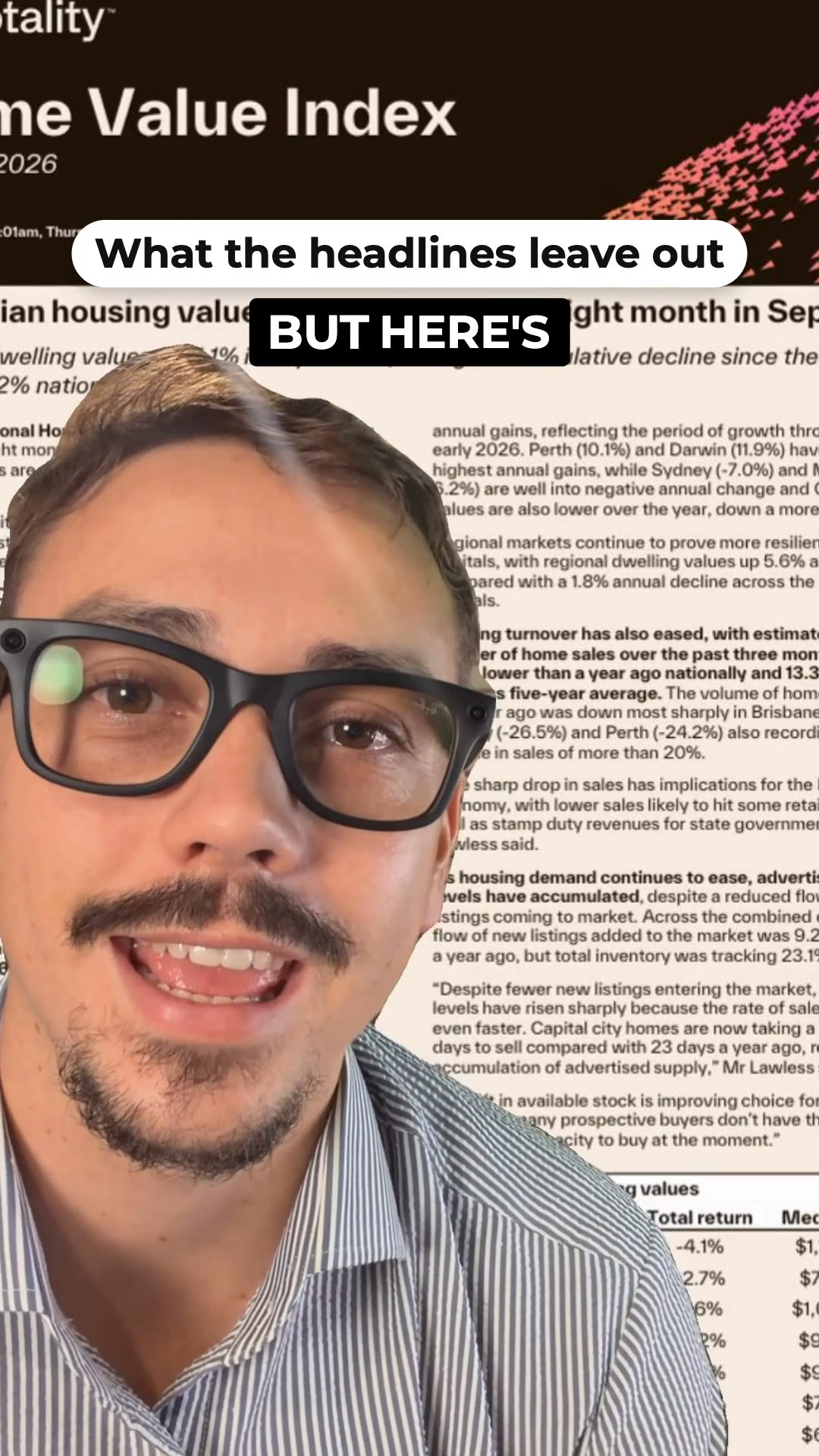 A presenter in glasses and a striped shirt speaks to camera in front of a printed housing market report
